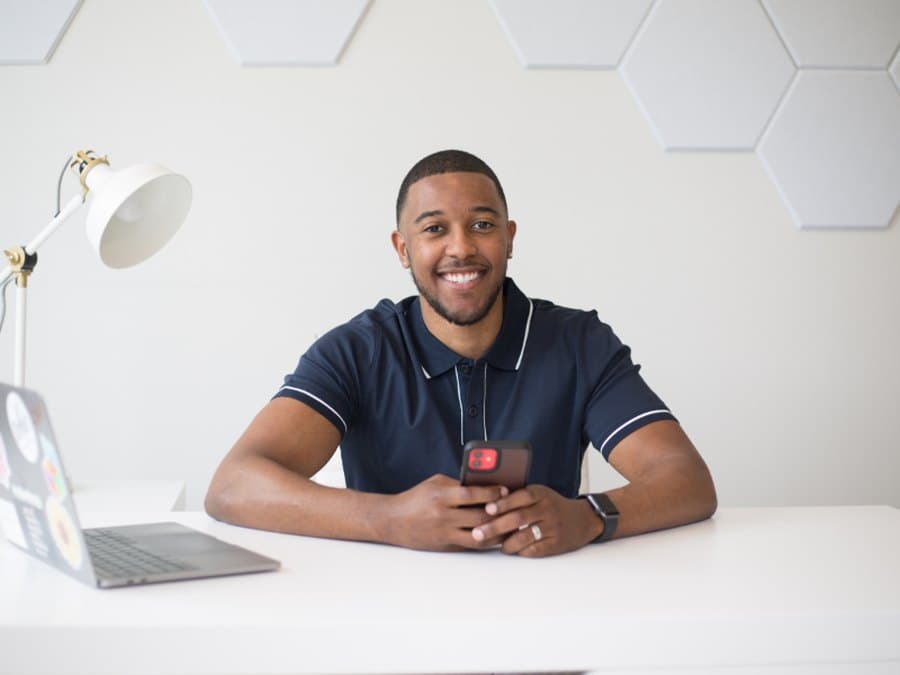 A student smiling during an online Maths lesson