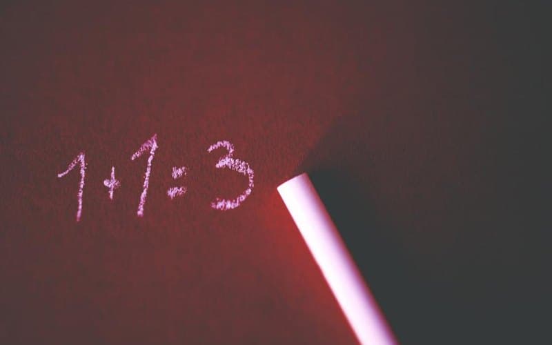 The incorrect equation one plus one equals three written in light